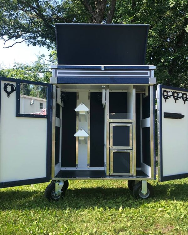 Open tack trunk with storage compartments.