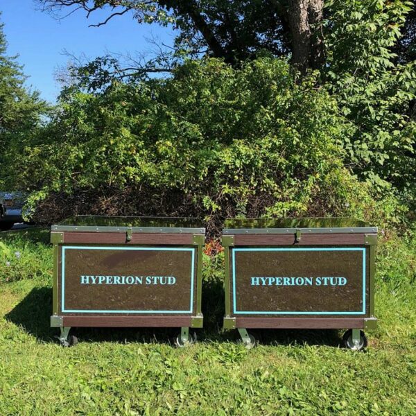 Two Hyperion Stud rolling chests outdoors.