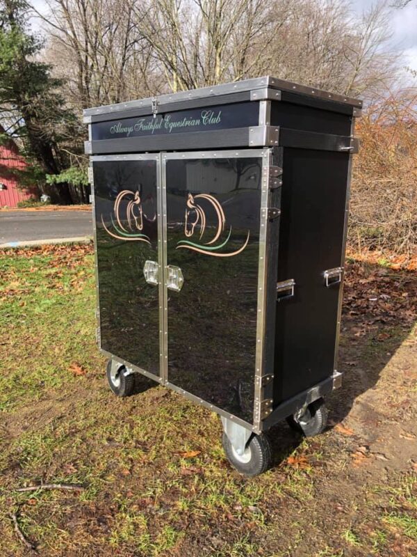 Black horse tack trunk on wheels.