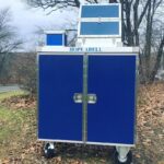 Hope Abell blue mobile donation box.