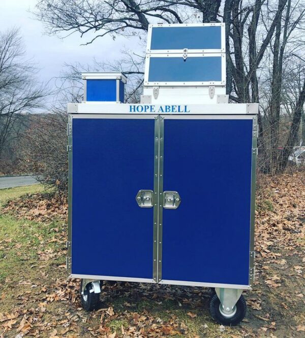 Hope Abell blue mobile donation box.