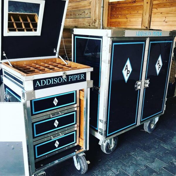 Here's an alt tag for the image: Addison Piper custom tack trunks.
