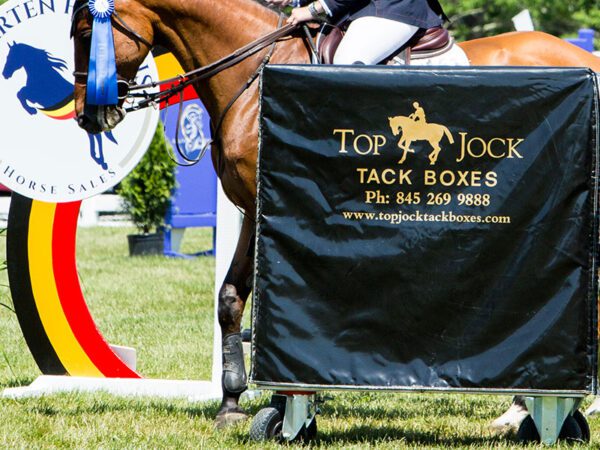 Here's an alt tag for the image: Brown horse, Top Jock tack boxes.