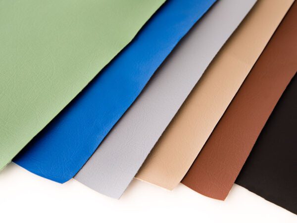 Here's an alt tag for the image: Multicolored vinyl fabric swatches.