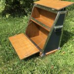 Open wooden storage cabinet with shelves.