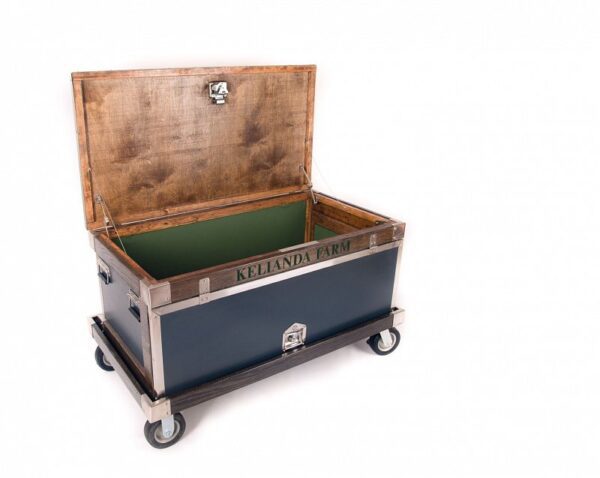 Here's an alt tag for the image: Open Kelianda Farm storage trunk on wheels.