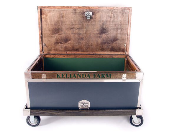 Here's an alt tag for the image: Kelianda Farm rolling storage trunk.